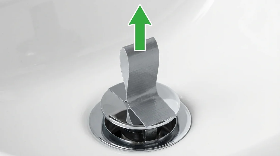 Technique de l'adhésif pour soulever un bouchon de lavabo sans tirette